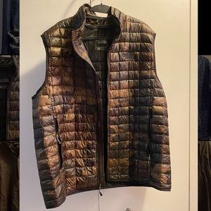 Dark camouflage North Face quilted vest